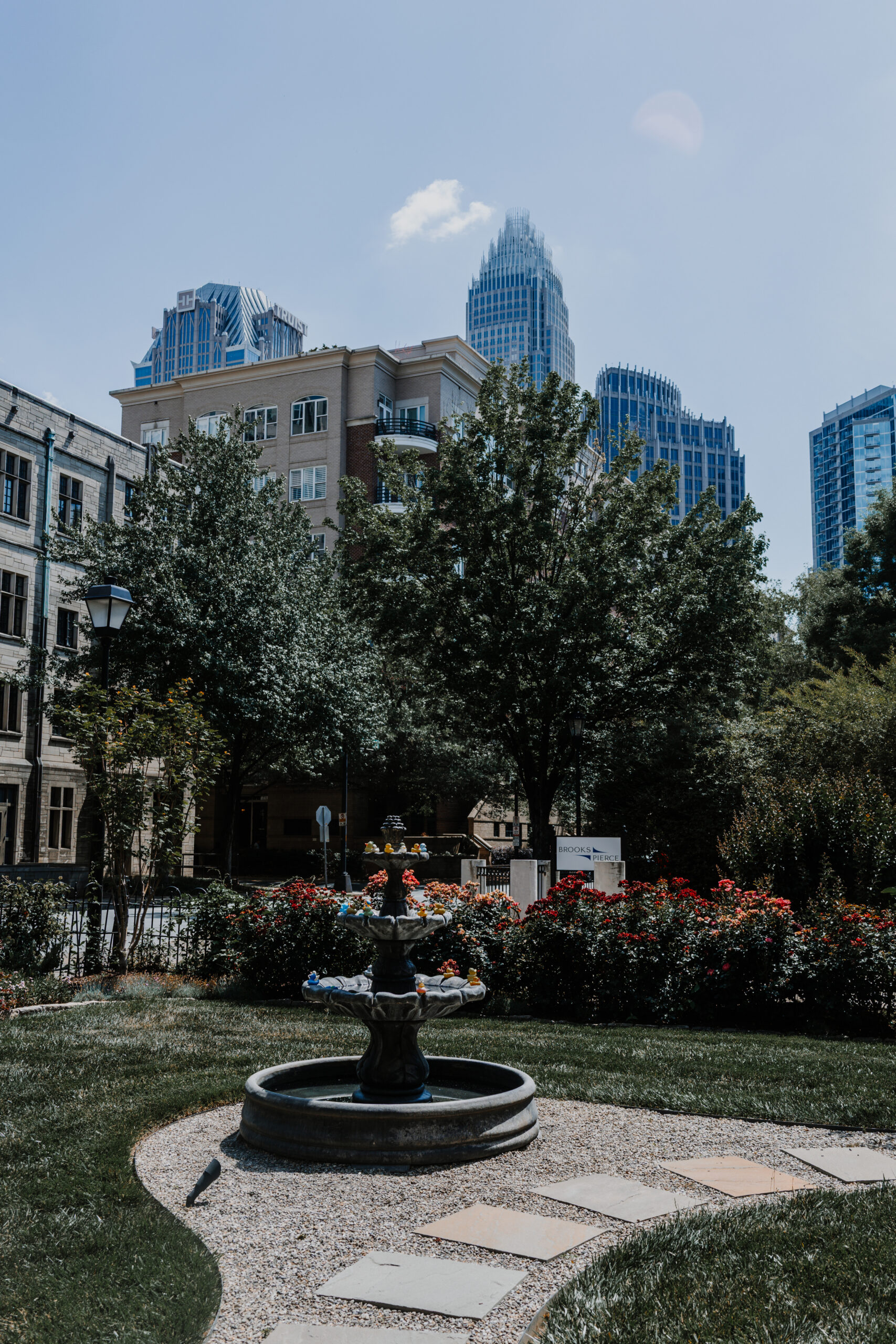 Private Events McNinch House front yard fountain with Charlotte skyline