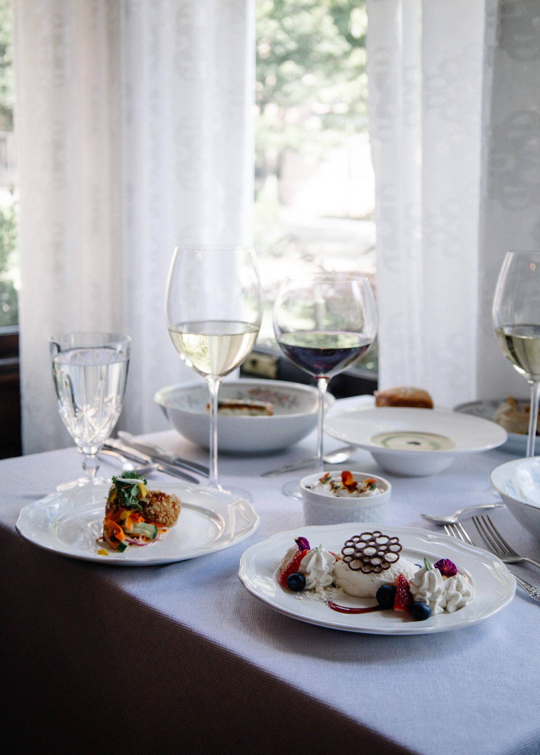 Table setting with a variety of dishes at McNinch House Restaurant